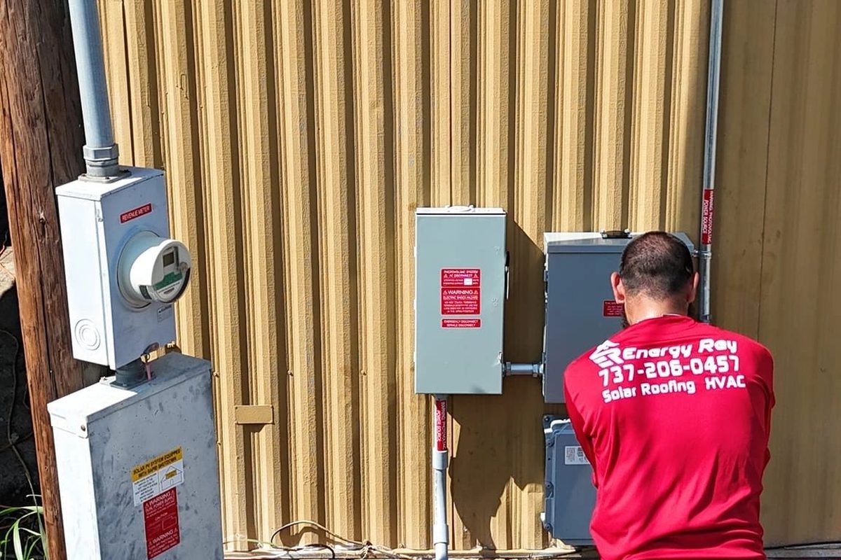 Energy Rey technician installing electrical equipment